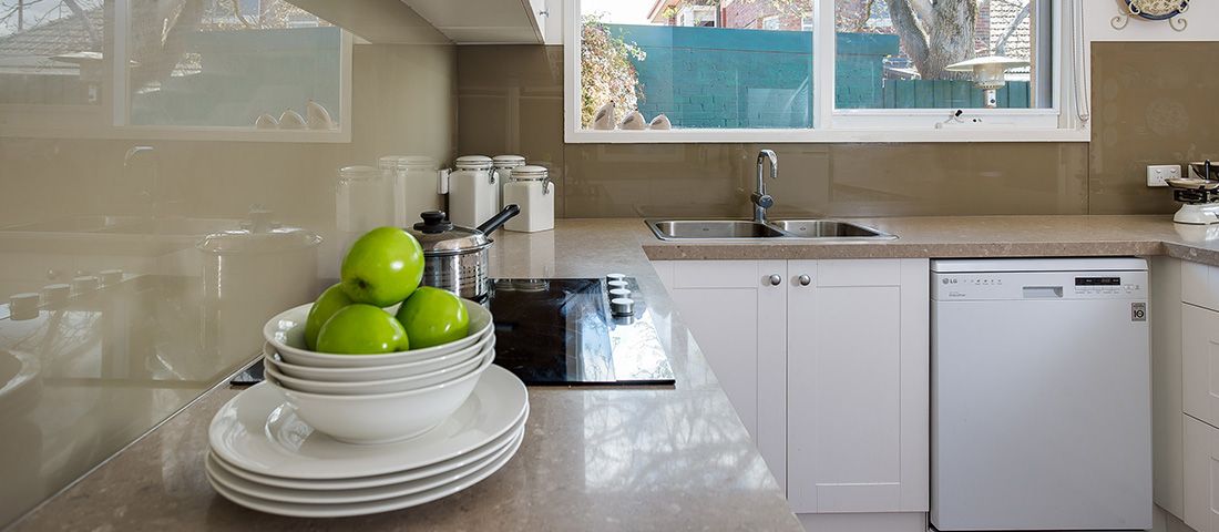 white shaker kitchen with quartz benchtop