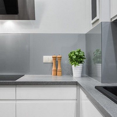 white handleless kitchen with grey concrete look benchtop