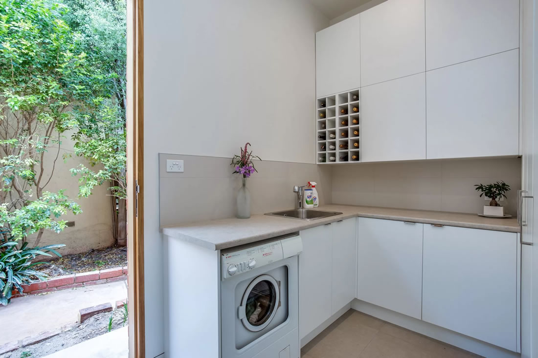 White laundry with built in wine rack