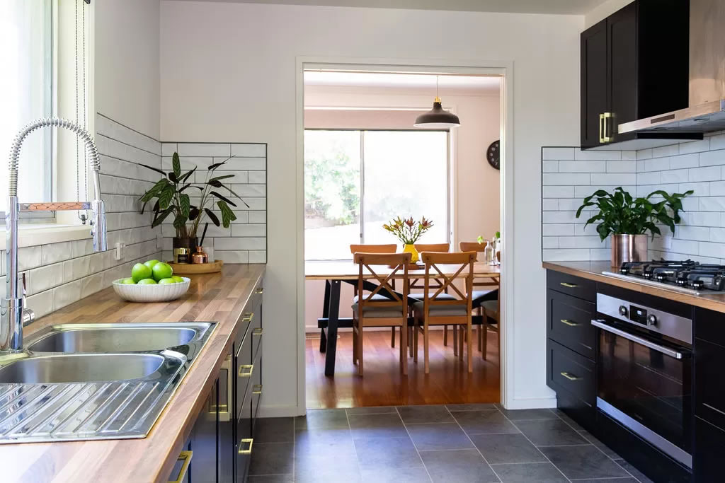 Kitchen breakfast nook with black cabinetry